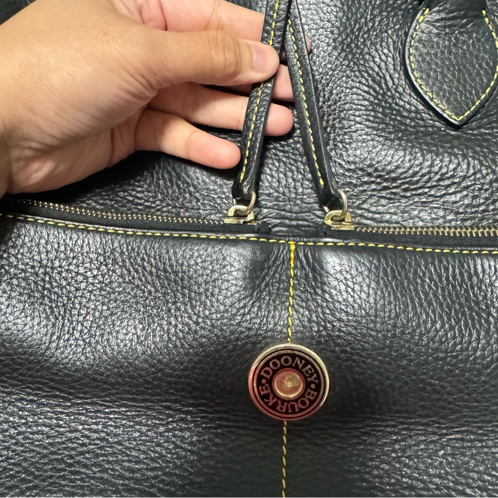 Dooney & Bourke Black Leather Tote with Yellow Stitching and Logo Medallion